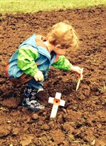 Child Laying Poppy Cross