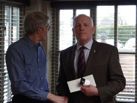 Presentation of Legion gold badge to John Crisford