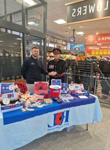 A person in uniform shaking hands with a person in uniform

AI-generated content may be incorrect.