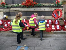 Children laying wreaths