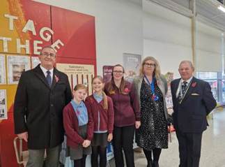 A group of people posing for a photo

AI-generated content may be incorrect.